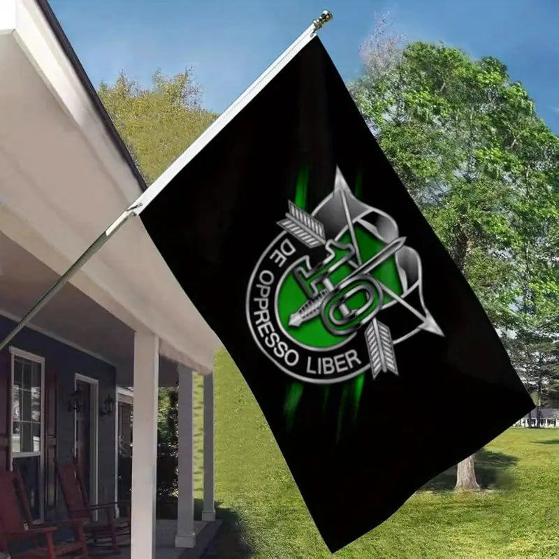 10th Special Forces Flag flying on a porch flagpole with green and black design outdoors