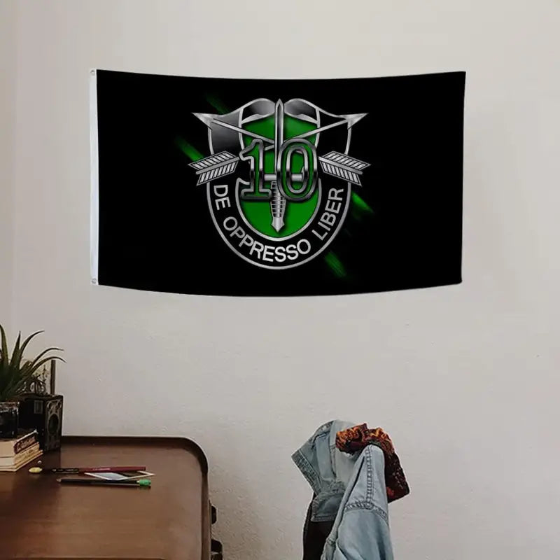 10th Special Forces Flag with emblem on black background hanging on wall in room