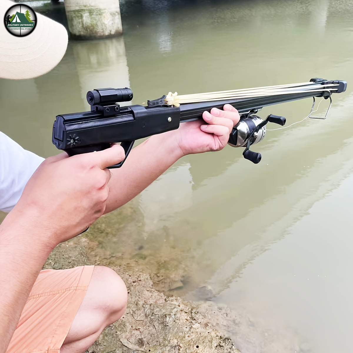 Military-Outdoors.com automatic fish shooting slingshot crossbow held by a person near water