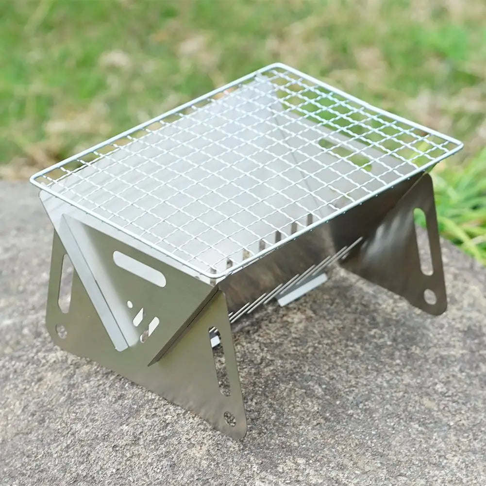 Military Outdoors stainless steel portable folding grill with wire cooking grate and foldable legs for camping