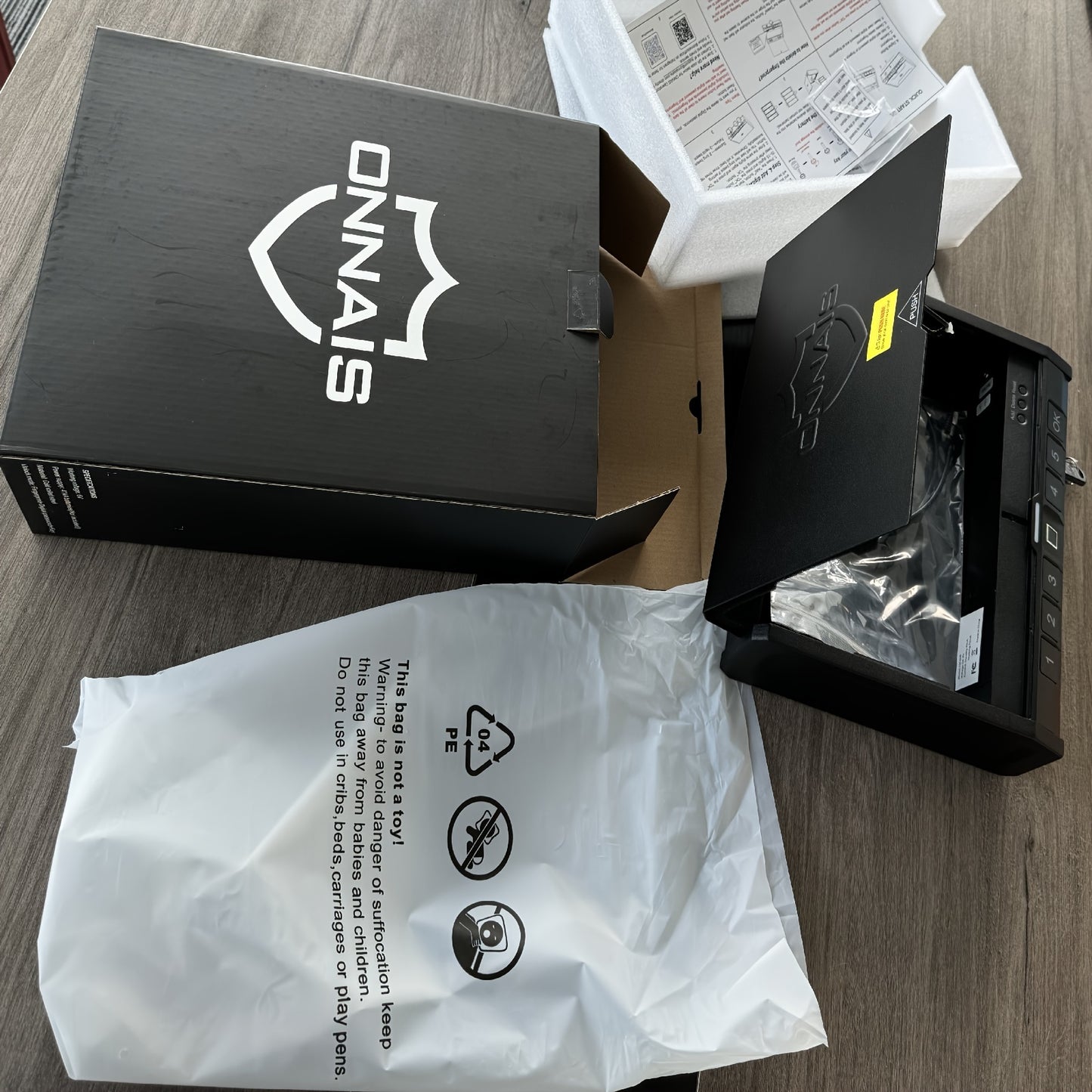 Unboxed biometric gun safe for pistols with packaging and protective plastic from Military-Outdoors.com