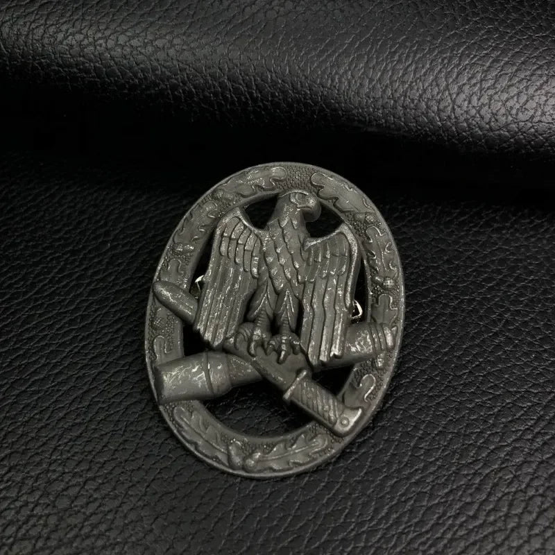 German assault operations medal featuring an eagle and crossed rifles on a textured background