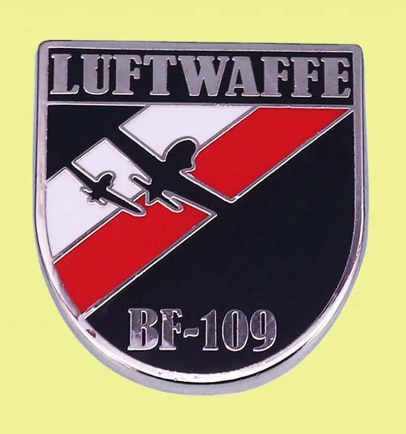 Shield badge with BF 109 airplane silhouette over red white diagonal stripe and LUFTWAFFE text German Luftwaffe badges