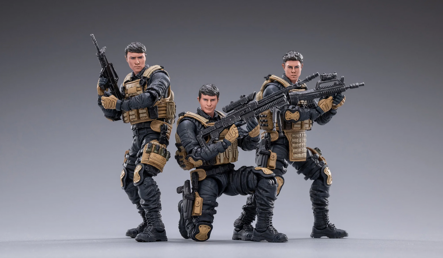 JOYTOY special forces set action figures in tactical gear holding rifles posed on gray background