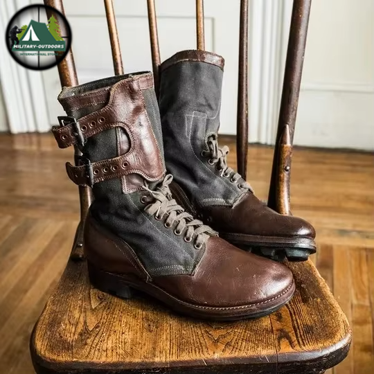 Brown and black leather medieval archery boots with laces and buckles on wooden chair