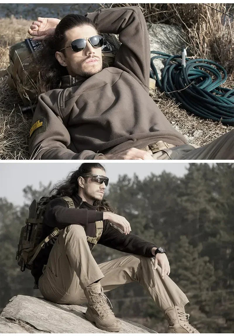 Military-Outdoors.com tactical windproof sweater worn by man resting outdoors and sitting on rock