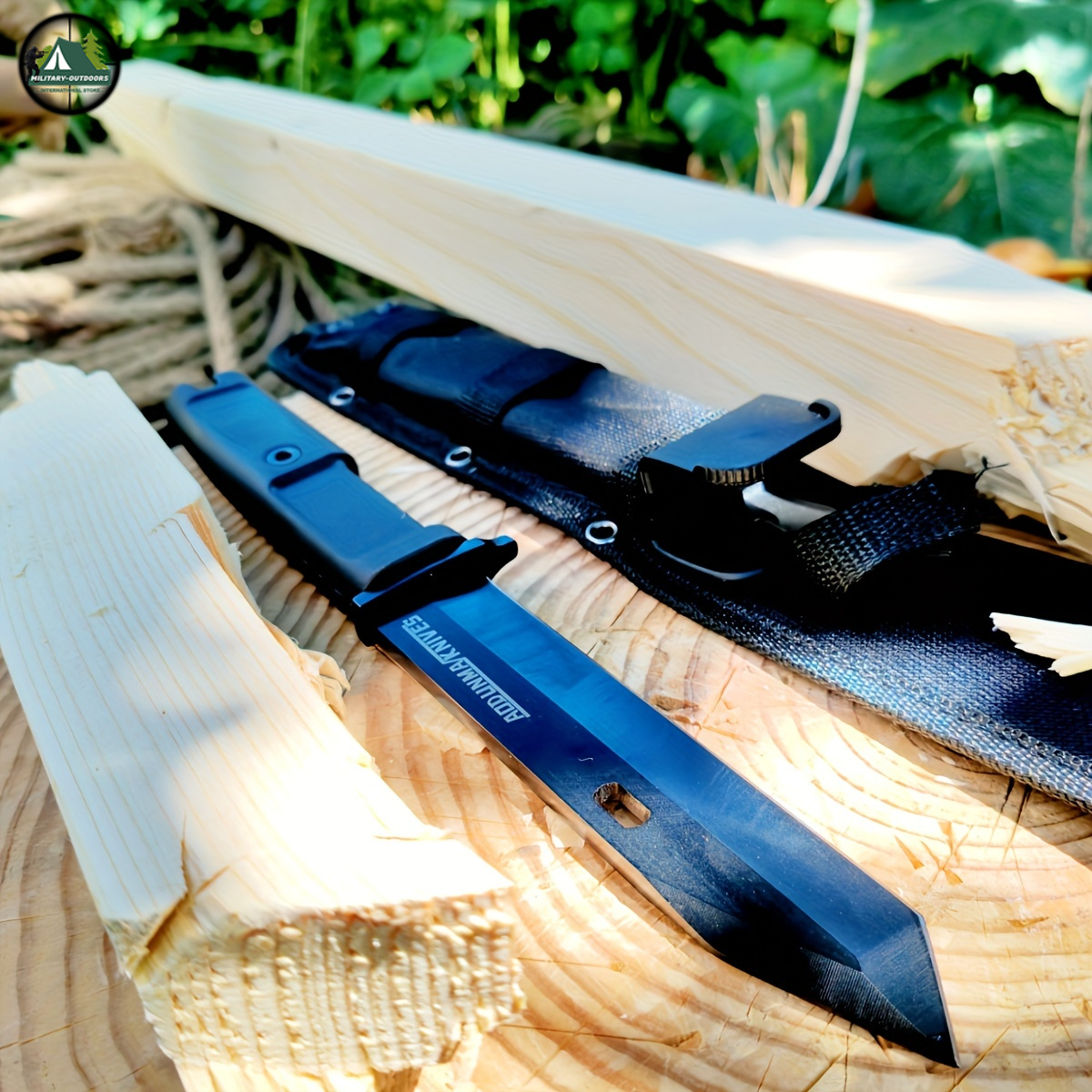 wilderness survival multi-purpose knife in black with nylon sheath on split pine wood for bushcraft