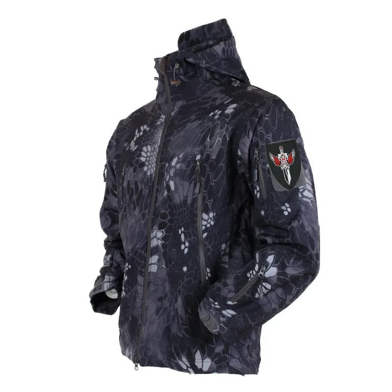 Military winter jacket with black and gray camouflage pattern featuring a high collar and zippered pockets