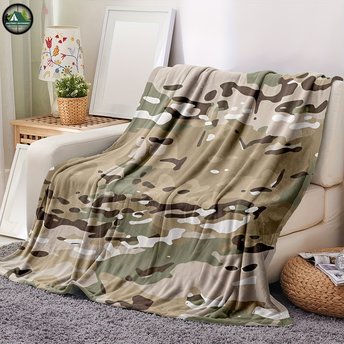 Camouflage flannel blanket draped over white couch in cozy living room setting