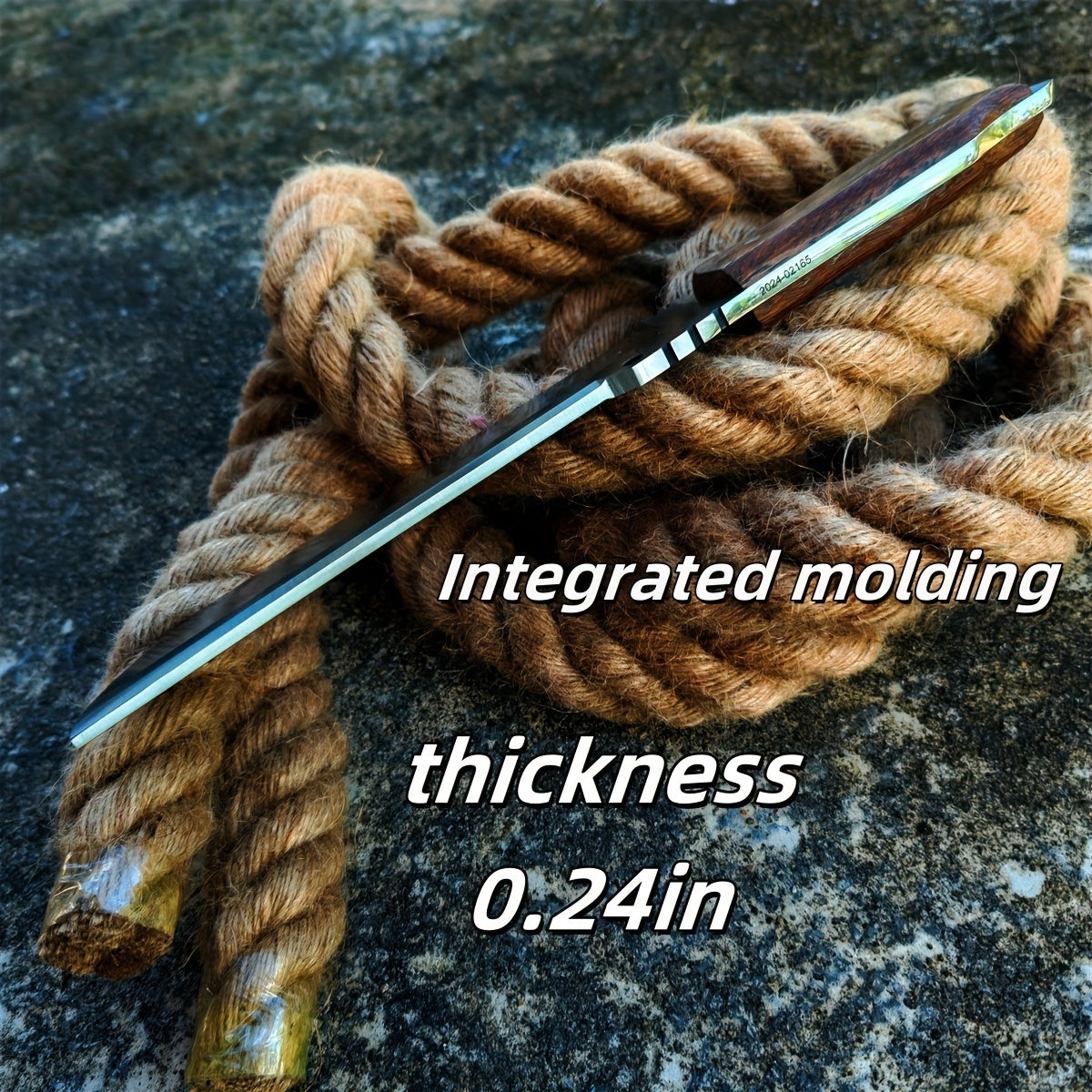 Slim survival knife with wood handle and thin quarter inch blade profile resting on coiled rope