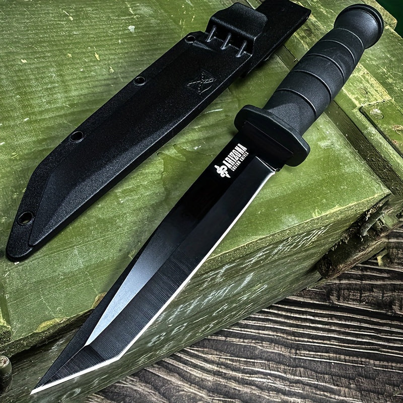 Military-Outdoors.com black stainless steel army knife with textured handle and protective sheath on wooden surface