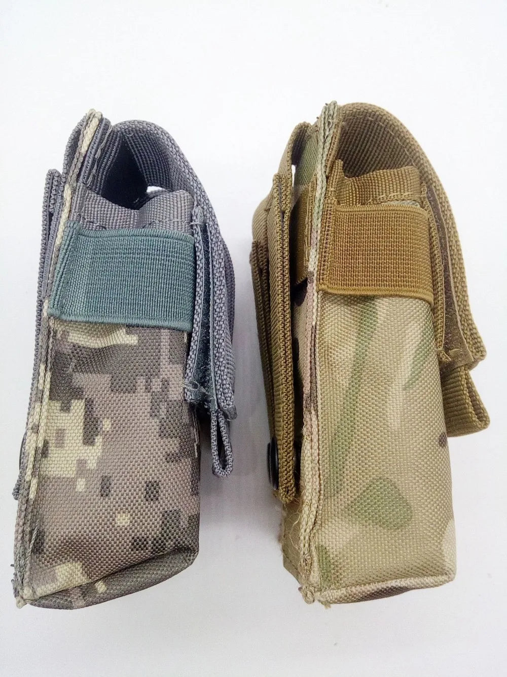 Two camouflage 9mm magazine holder pouches side by side with secure flap closures