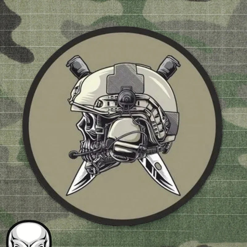 Army logo patch featuring a skull wearing a tactical helmet with crossed knives behind it tactical helmet badge