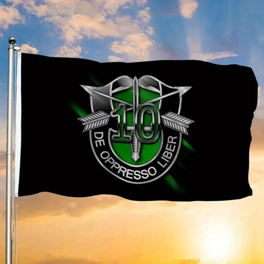 Black 10th Special Forces Flag with green and silver emblem flying against a sunset sky