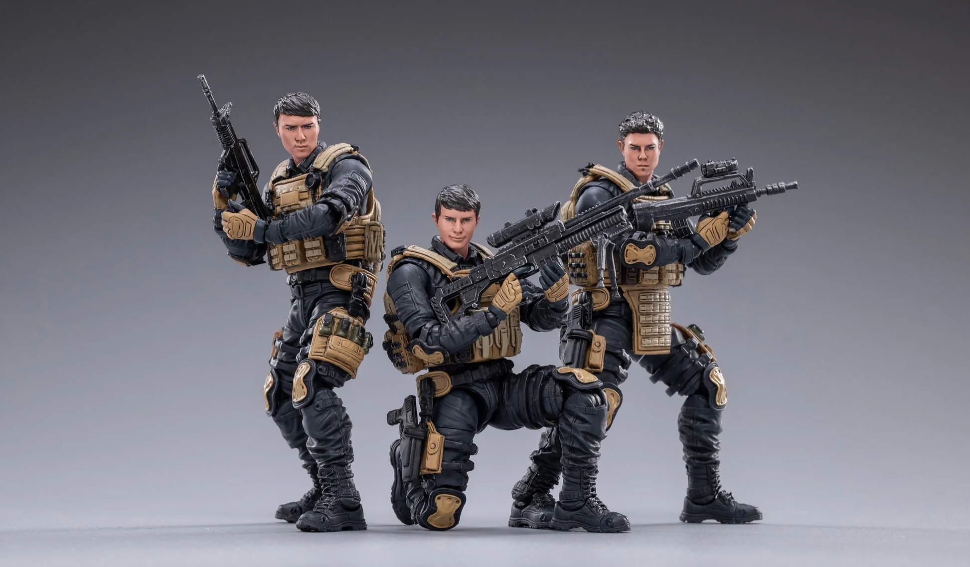 JOYTOY special forces set action figures in tactical gear holding rifles posed on gray background