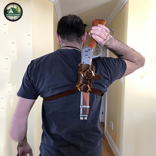Man wearing brown leather cowboy shoulder gun holster carrying a lever action rifle on his back